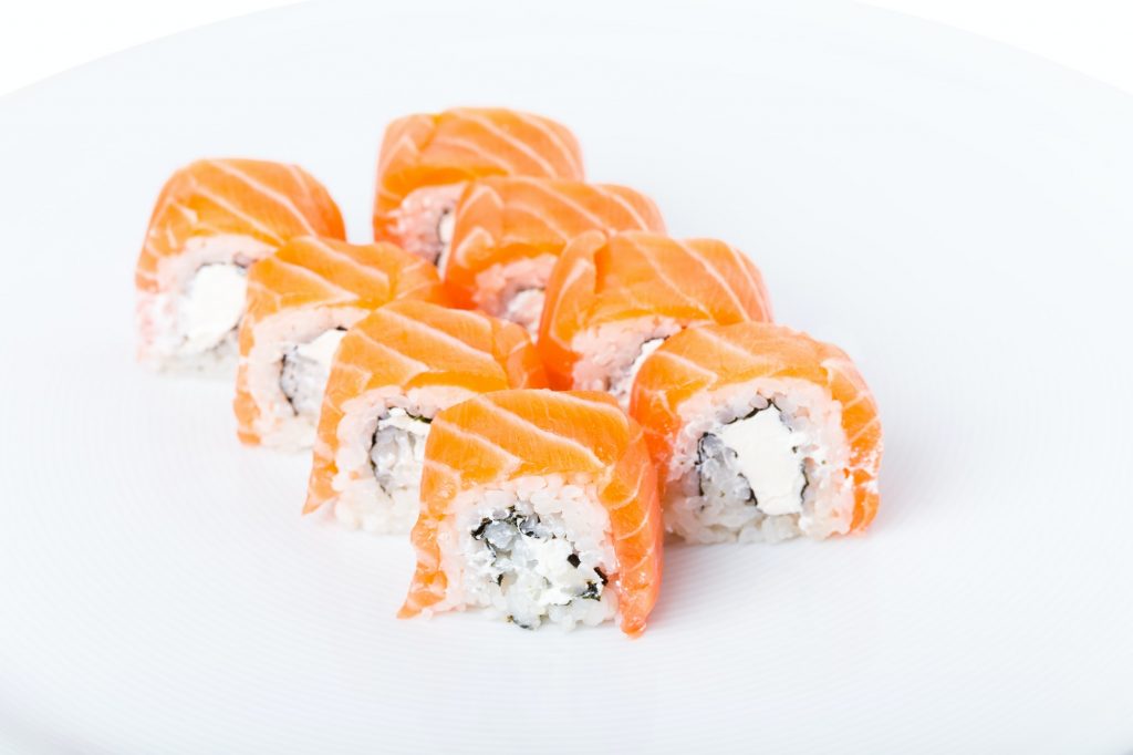 Delicious salmon sushi roll with mayonnaise.